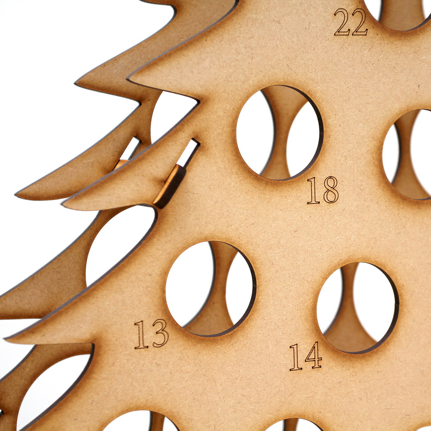 Close up detail of laser engraving on MDF bottle tree advent calendar