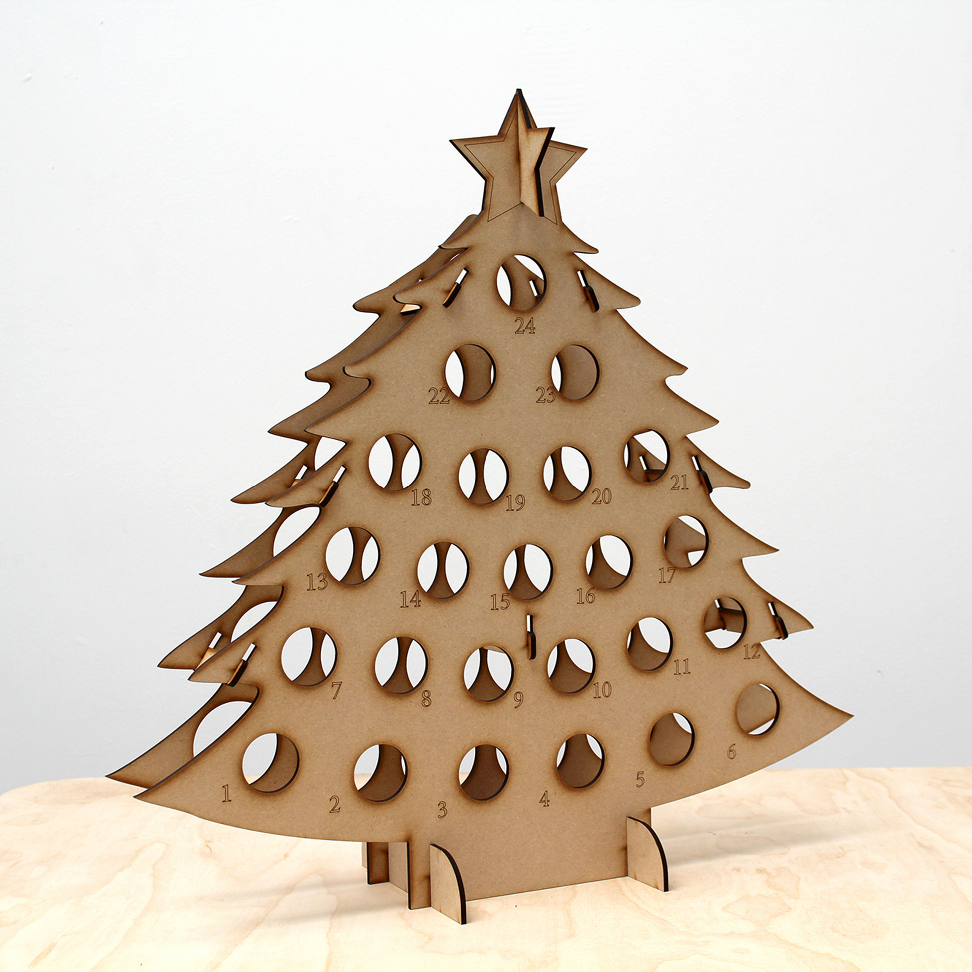 Empty MDF bottle tree advent calendar in front of white background