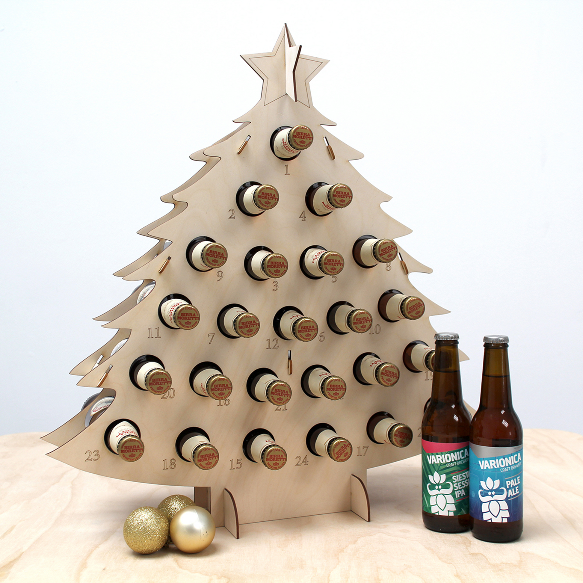 Birch plywood bottle tree advent calendar filled with beer in front of white background