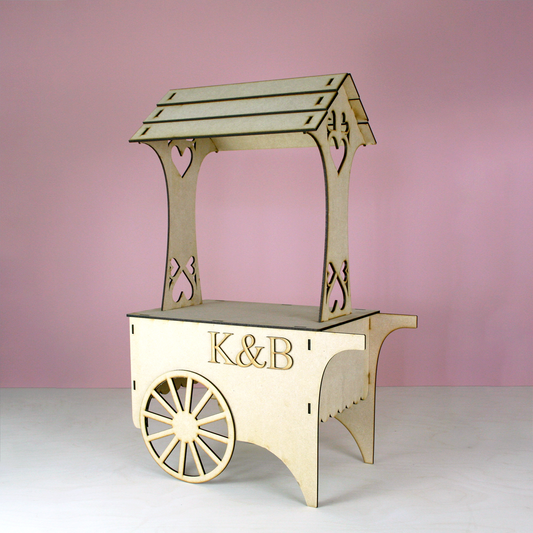 MDF Candy Cart with initials K&B in front of pink background