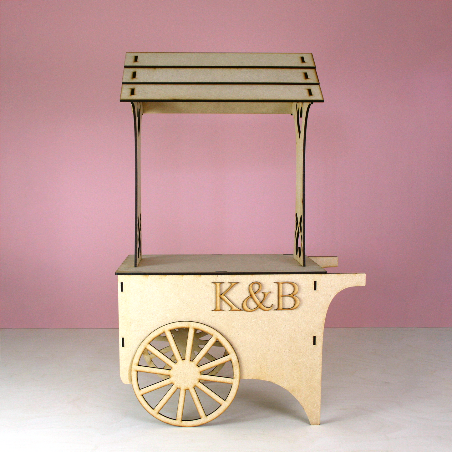 MDF Candy Cart with initials K&B in front of pink background