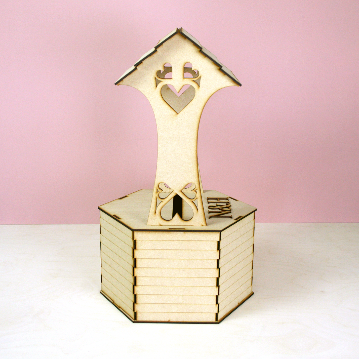 MDF wishing well shaped postbox for cards in front of pink background